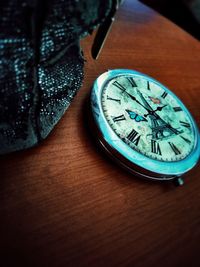Close-up of clock on table