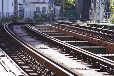 Railroad tracks amidst buildings