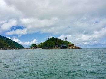 Scenic view of sea against cloudy sky