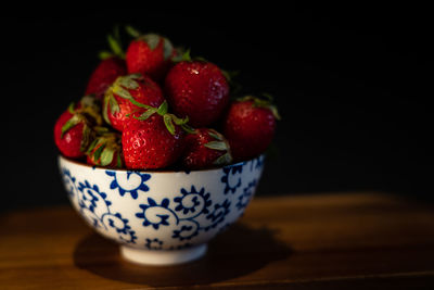 Close-up of strawberries in bowl on table