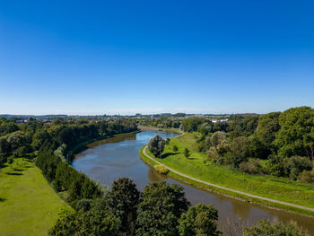 High angle view of sea against clear blue sky