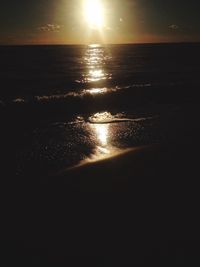 Scenic view of sea against sky at sunset