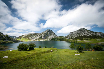 Scenic view of lake and mountains against sky