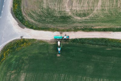 Field treatment with herbicides. tractor with a sprayer drives up to the gas station to the tractor 