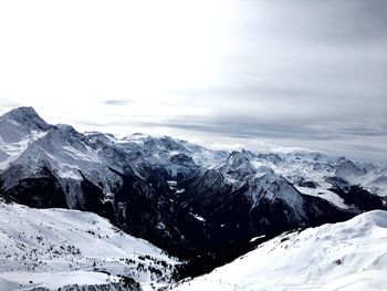 Scenic view of snowcapped mountains against sky