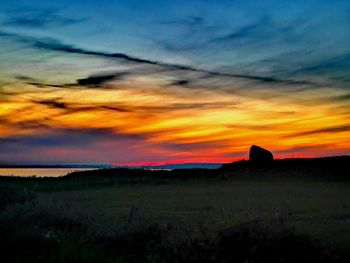 Scenic view of silhouette landscape against sky during sunset