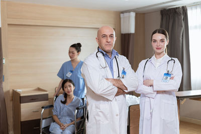 Portrait of female doctor standing in hospital