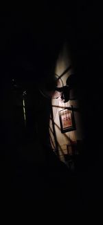 High angle view of silhouette man in darkroom