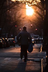 Rear view of man walking on street