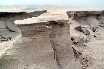 Scenic view of sand dune on beach