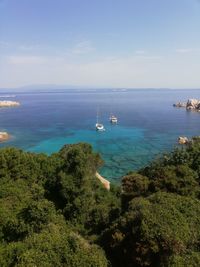 High angle view of sailboats on sea against sky