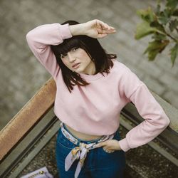 High angle portrait of woman standing outdoors