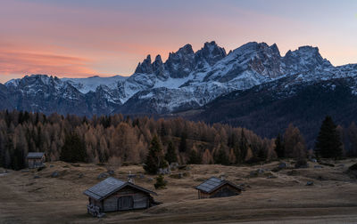 Scenic view of snowcapped mountains against sky during sunset