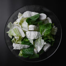 High angle view of vegetables in container on table