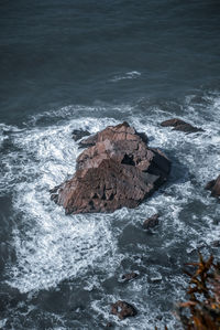 High angle view of rocks in sea