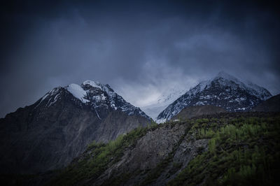 Scenic view of snowcapped mountains against sky