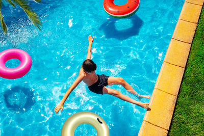 High angle view of man swimming in pool