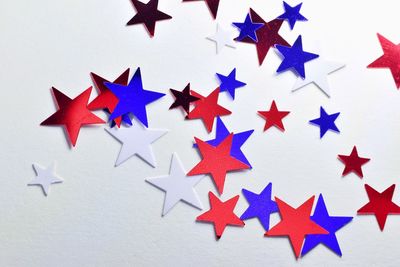 Multi colored star shapes on white background