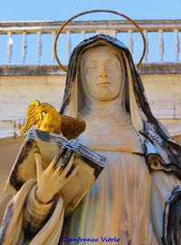 Low angle view of statue against building