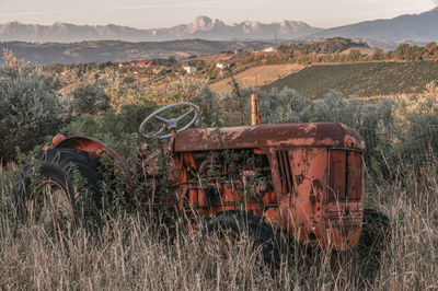 Abandoned tractor on field