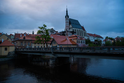 River amidst buildings against sky in city