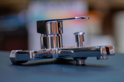 Close-up of drinking glasses on table