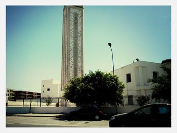 Buildings against clear blue sky