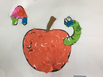 High angle view of multi colored paper on white background