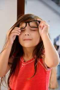 Close-up of cute girl wearing eyeglasses