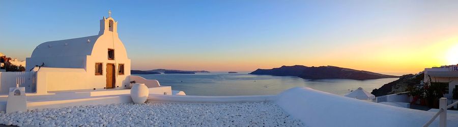 Panoramic view of sea against clear sky during sunset