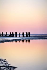 Scenic view of sea against orange sky