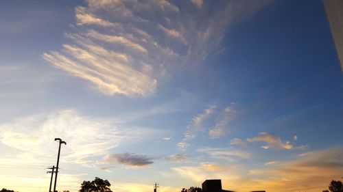 Low angle view of street light against sky