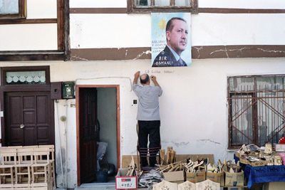 A partizan with politician poster