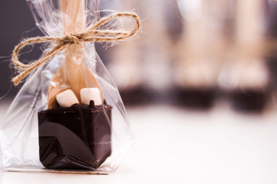 Close-up of wrapped chocolate on table