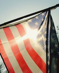 Low angle view of flag against clear sky