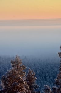 Scenic view of sea against sky at sunset