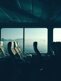 Empty seats in ship over sea