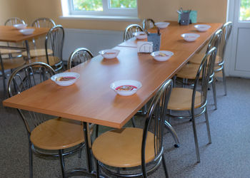 School kitchen canteen, set tables, canteen equipment, catering establishment, tables and chairs