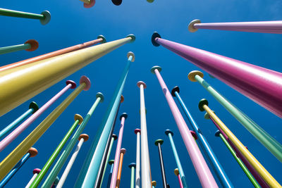 Coloris installation a representation of a world map, which stand about 100 pastel-color metal poles