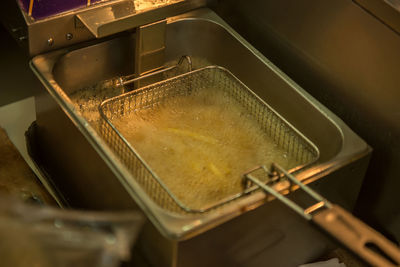 High angle view of french fries preparing in restaurant