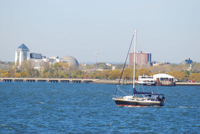 Small sailing boat on hudson river in new york city, us