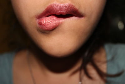 Close-up of woman with puckering lips