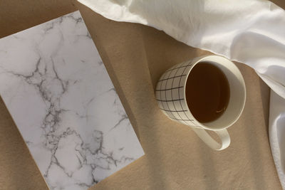 High angle view of coffee cup on table