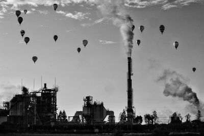 Low angle view of hot air balloons flying in sky