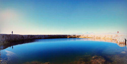 View of lake against blue sky