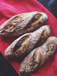 High angle view of homemade french baguettes on napkin