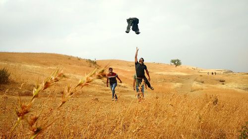 Friends on sand dune