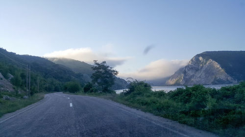 Country road leading towards mountains