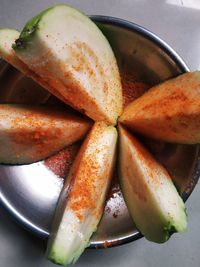 High angle view of fruits in plate on table