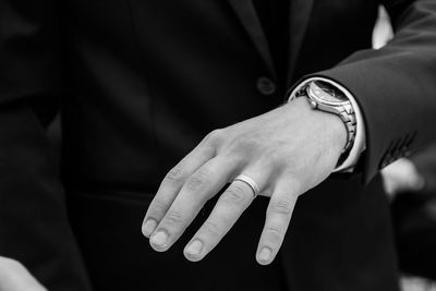 Close-up of the hand of a groom